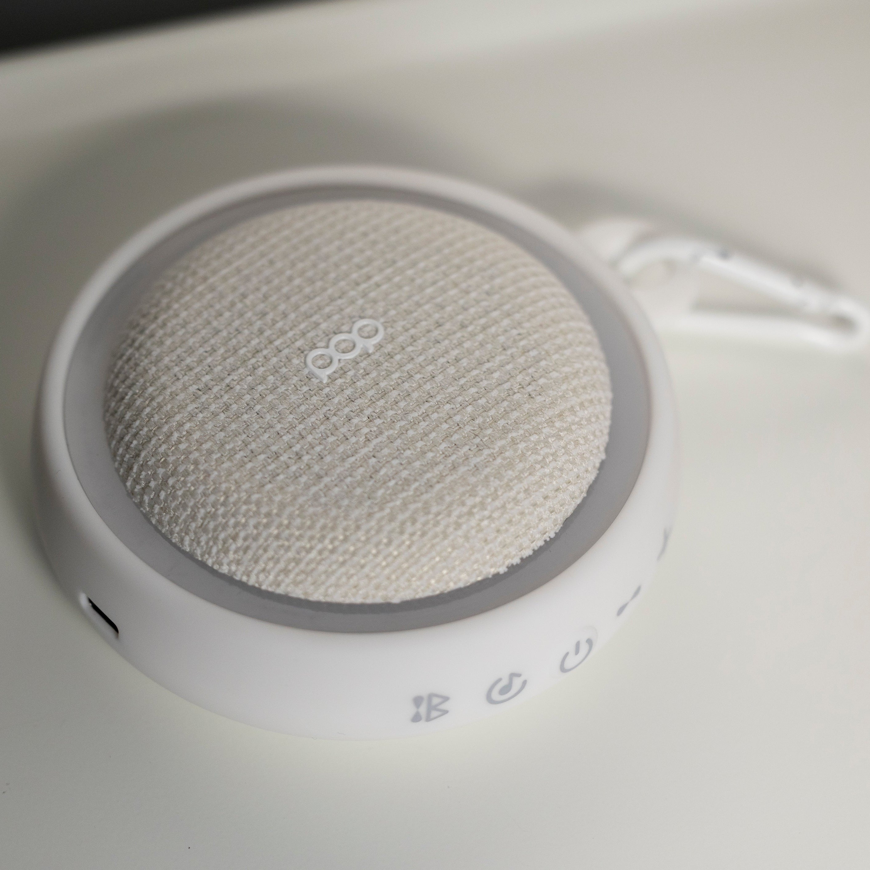 White colored sound machine with a white background