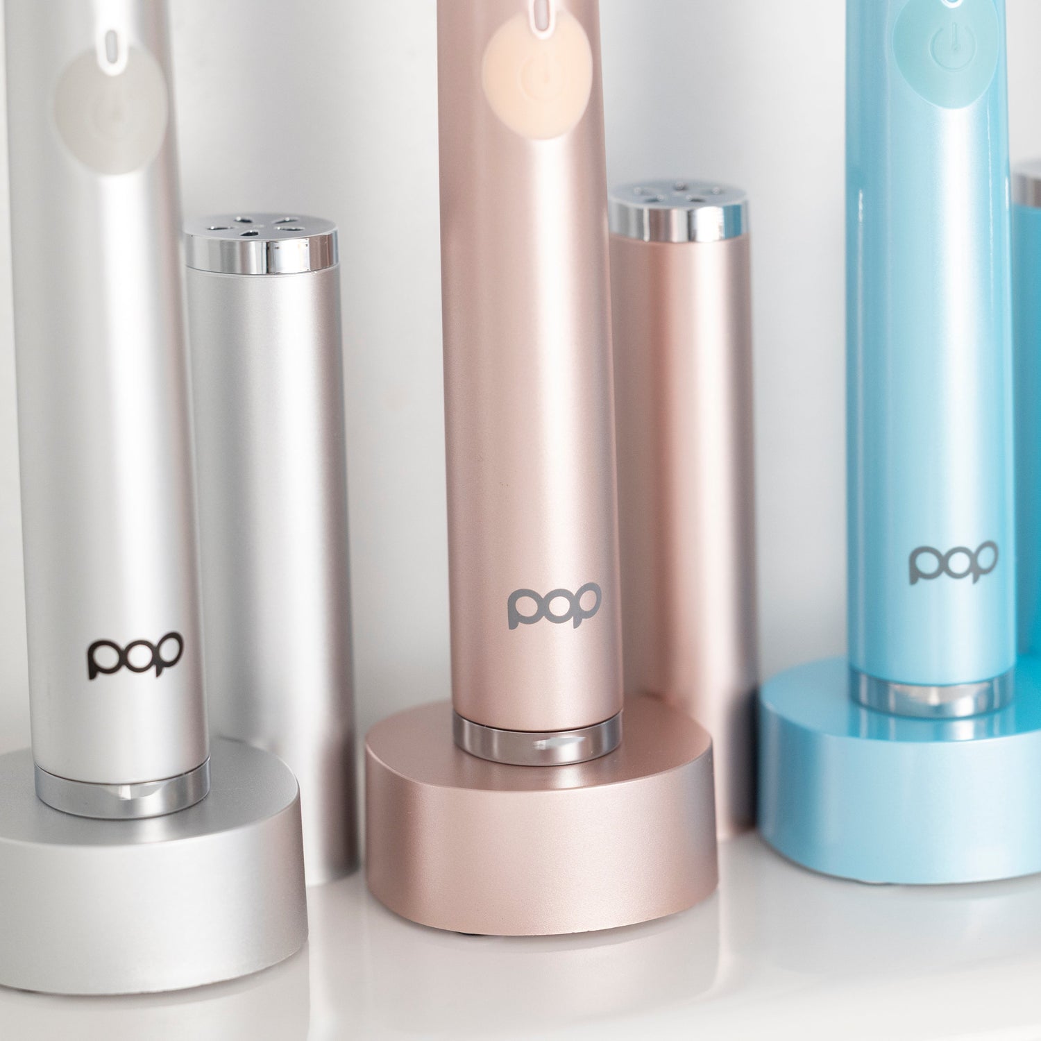 Set of Pop Sonic brand toothbrushes in various colors on a white background