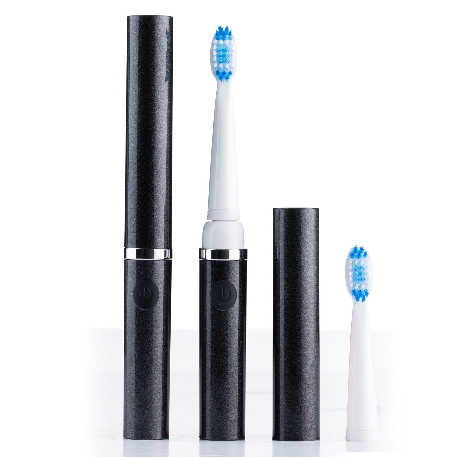 Blackelectric toothbrush with two replacement heads on a white background