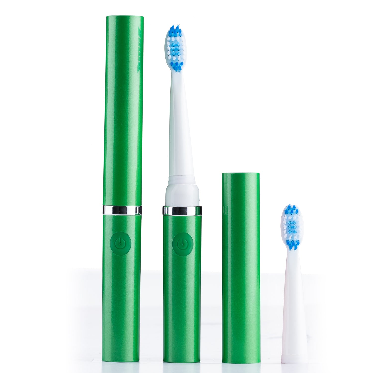 Green electric toothbrush set with two brush heads on a white background