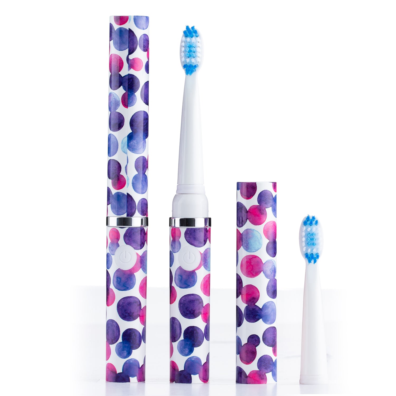 Electric toothbrush set with polka dot design on a white background
