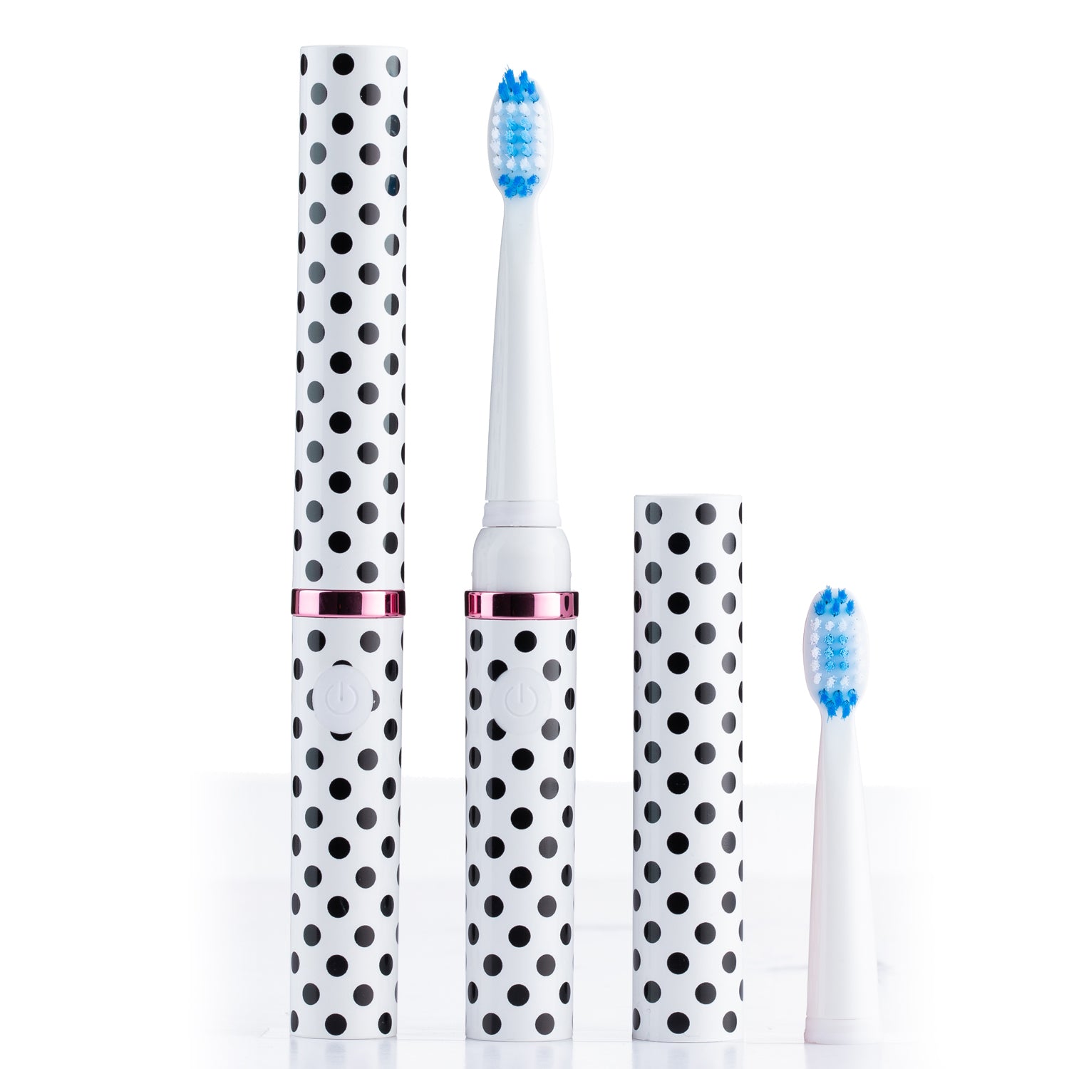 Electric toothbrush with polka dot design on a white background