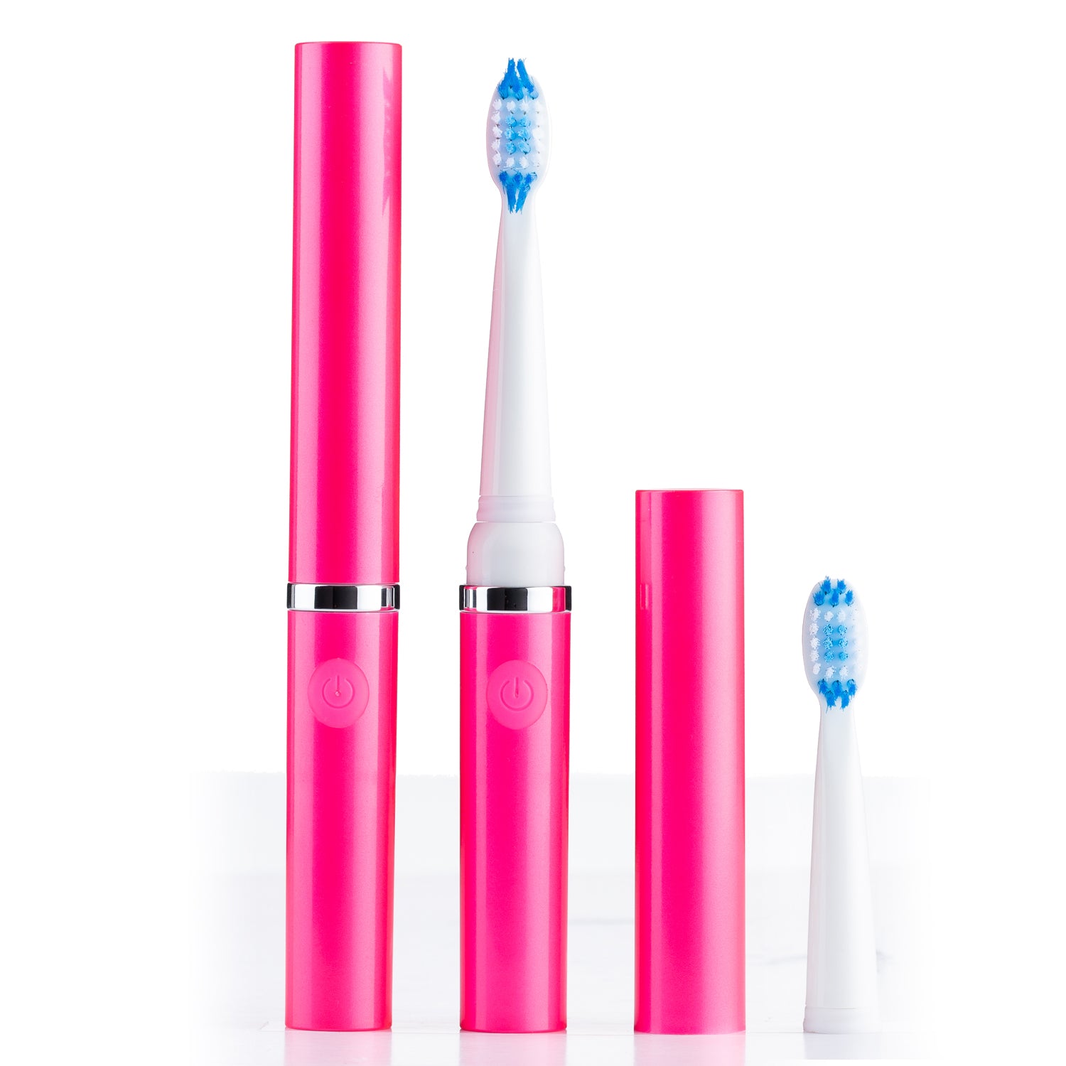 Pink electric toothbrush set with two brush heads on a white background