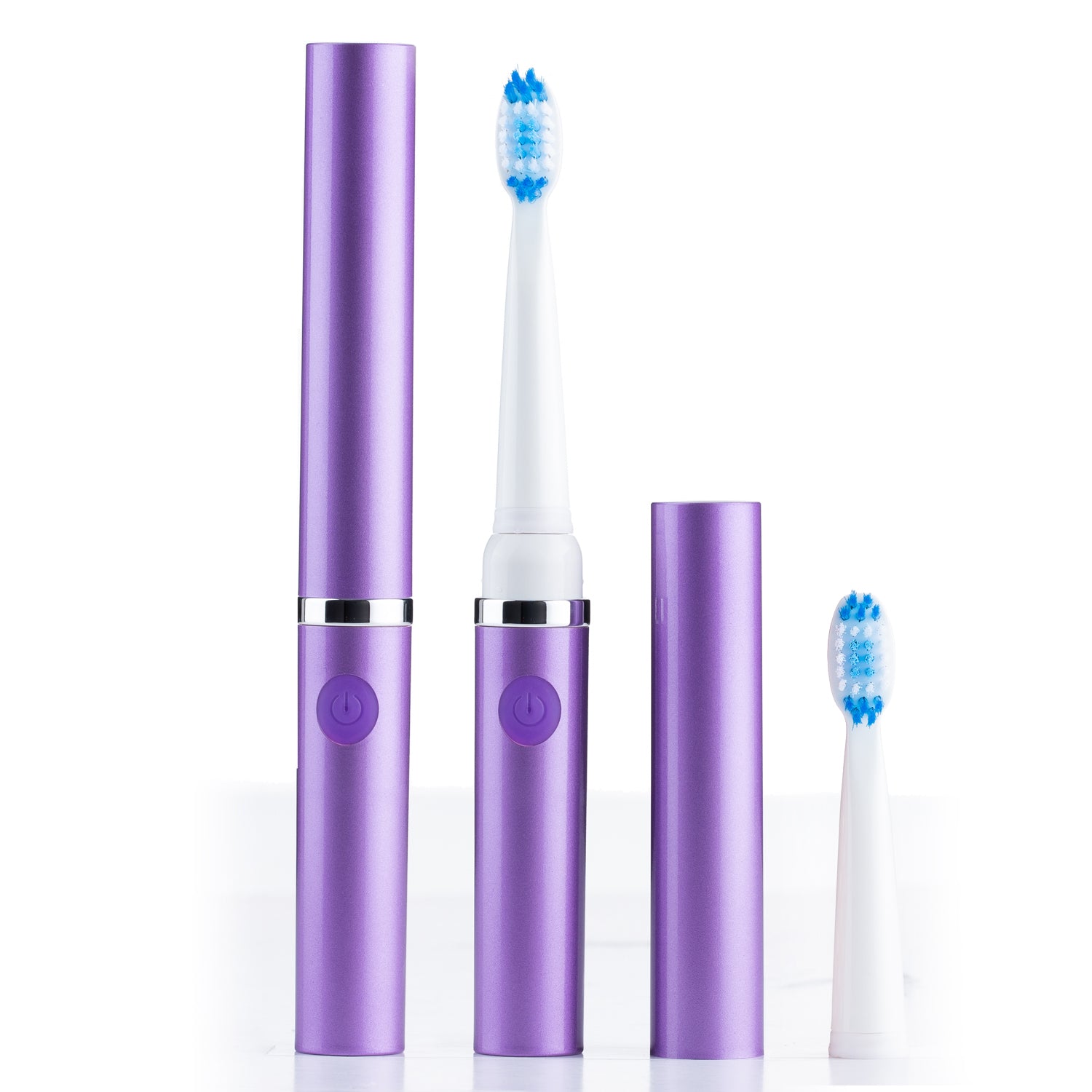 Purple electric toothbrush set with two brush heads on a white background