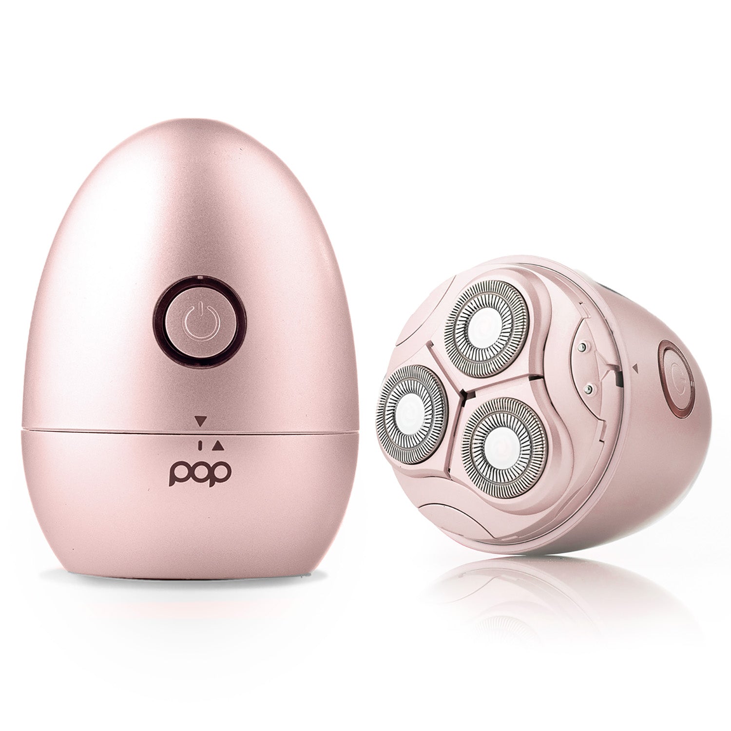 Rose gold electric shaver with charging base on a white background