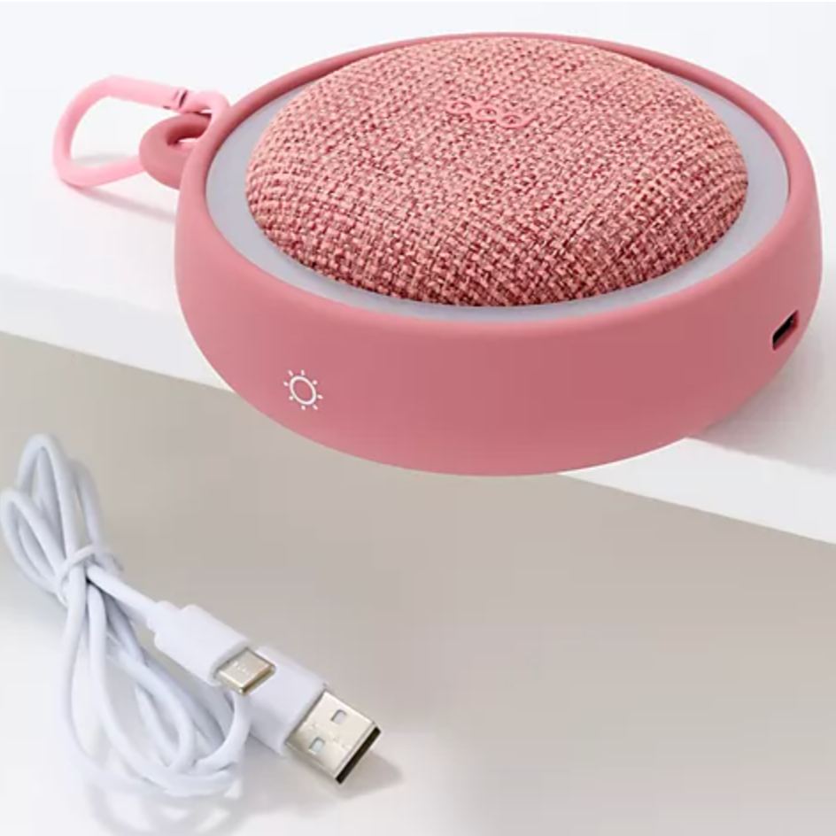 Pink sound machine with the white cord