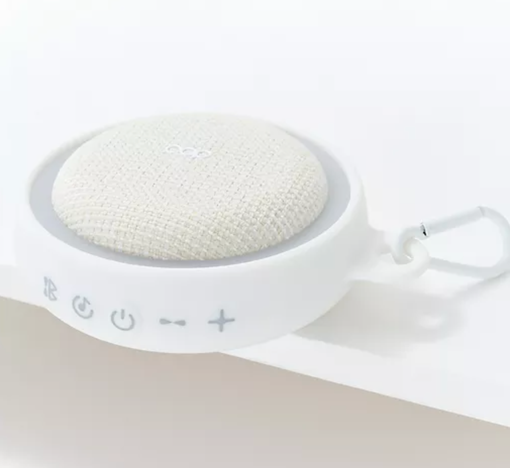 White electronic device with textured surface on a light beige background