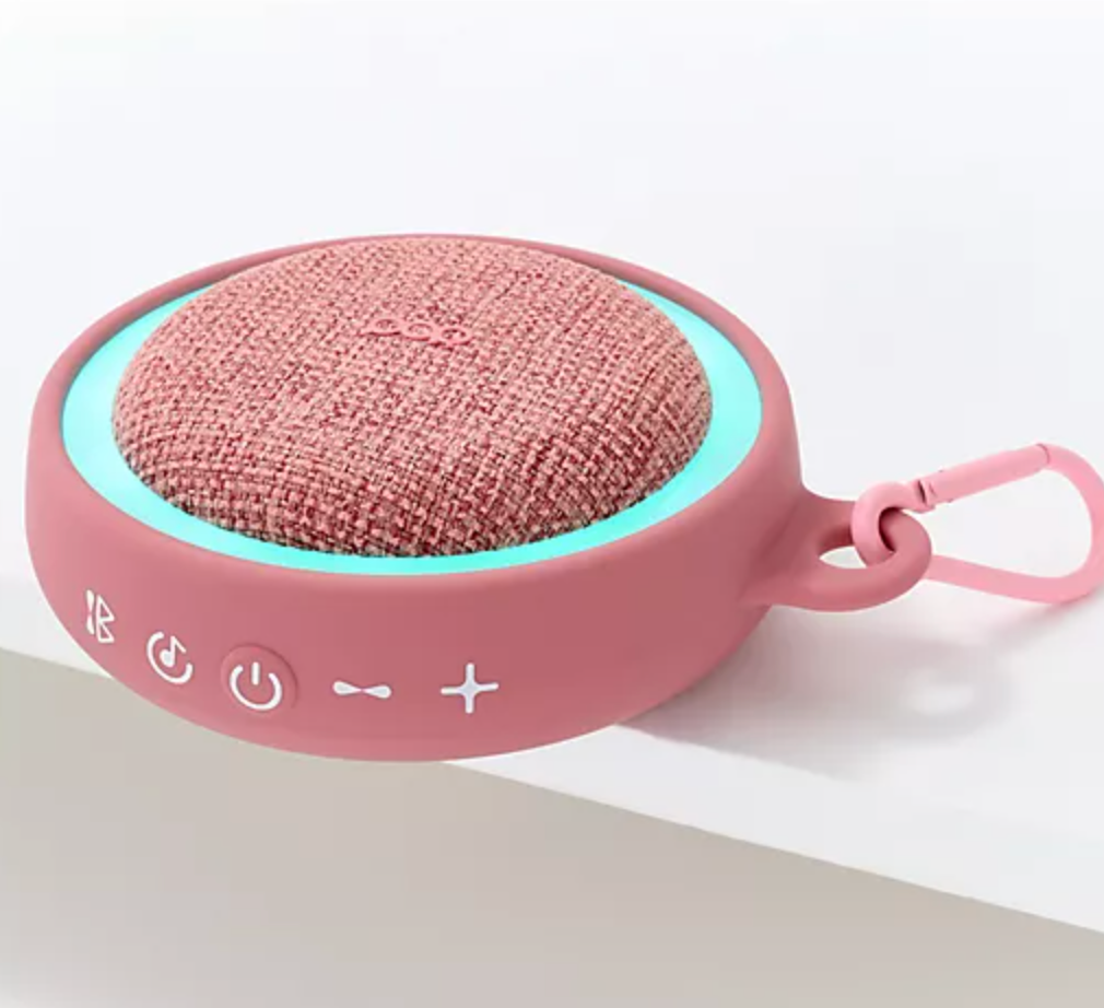Pink sound machine with the LED light on the blue-green color