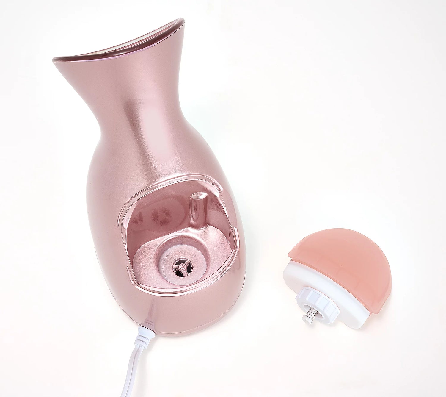Close-up image of the Rose Gold Nano Facial Steamer with the water compartment taken out to display the inside of the steamer.