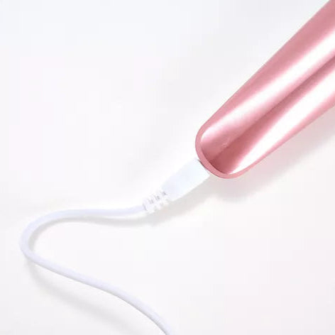 Bottom of the Sole Smoother in Rose Pink showing where the cord attaches to the device