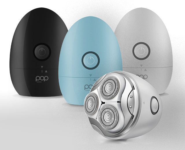 Three electric shavers in black, blue, and gray on a white background