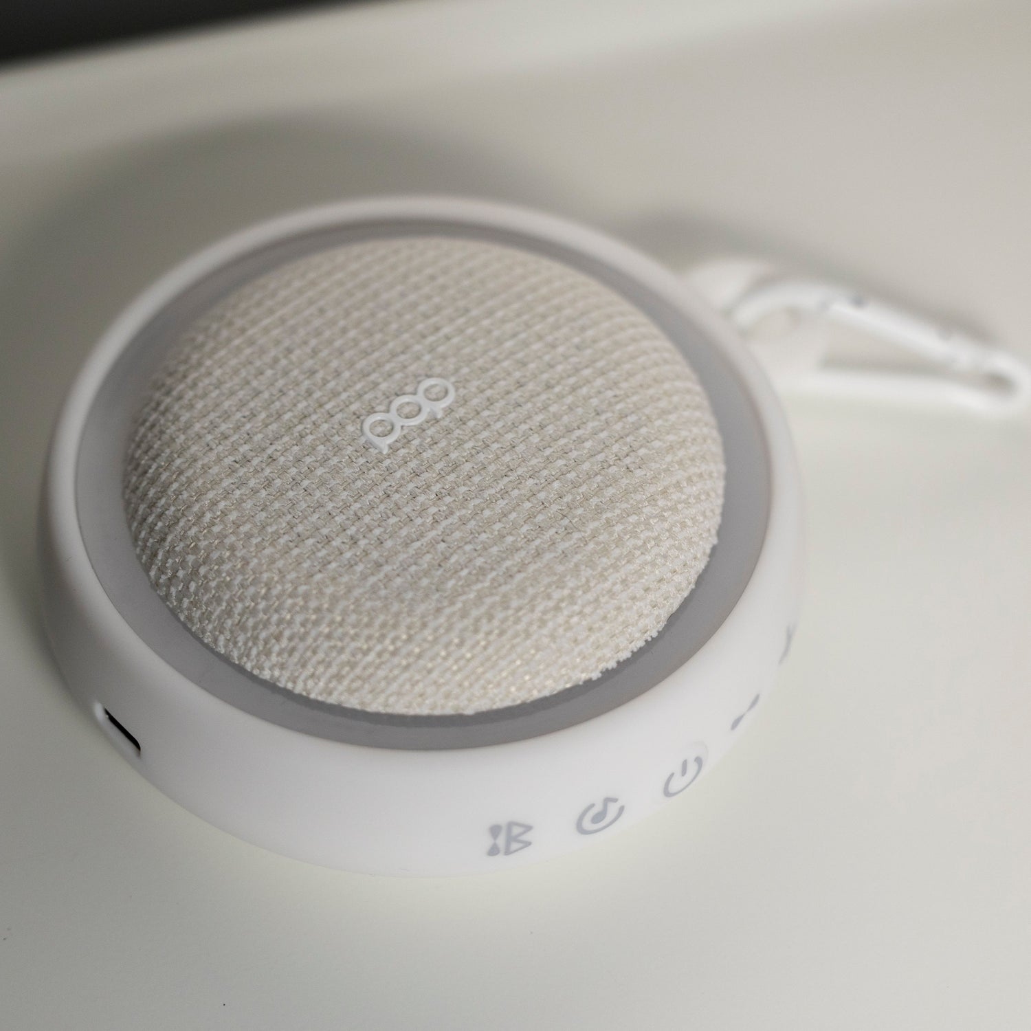 White colored sound machine with a white background