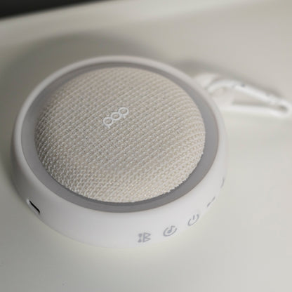 White colored sound machine with a white background