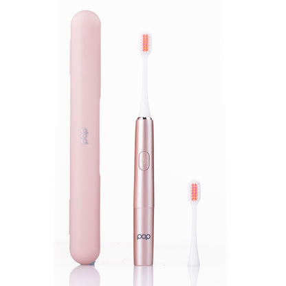 Rose Gold electric toothbrush with travel case on a white background