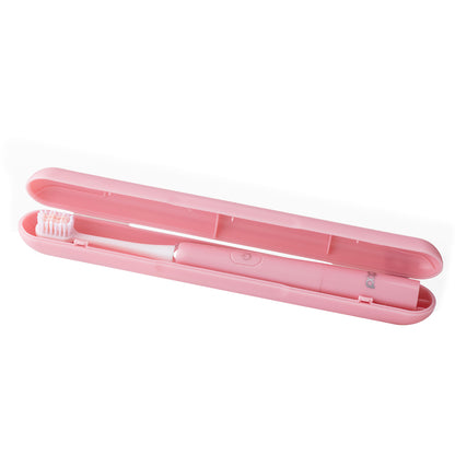 Pink toothbrush with travel case on a white background