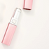 Pink electronic device with silver top on a white background
