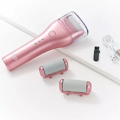Image of the Pedi Pro 2.0 in pink, laid out next to 2 additional grinding heads,  black brush to clean the device, and a white cord