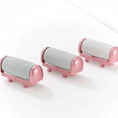 An image of the 3 grinding heads that come with the Pedi Pro, all in Pink