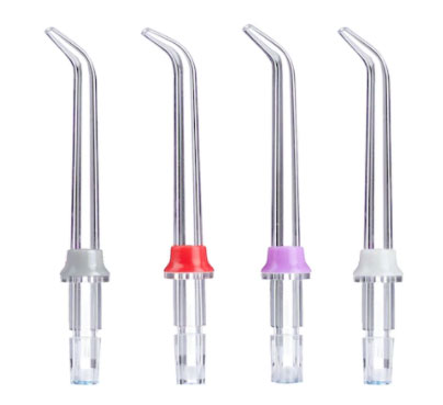 Set of four dental water flosser nozzles on a white background
